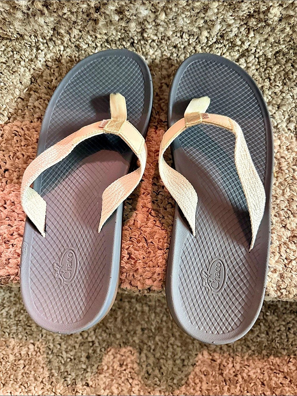 Chaco Women's Flip Flop Sandals in Cream with grayfootbed and brown soles. Like